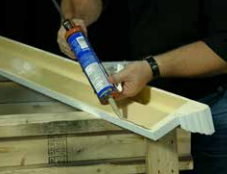 Applying ADH100 adhesive to the back of a Spectis crosshead